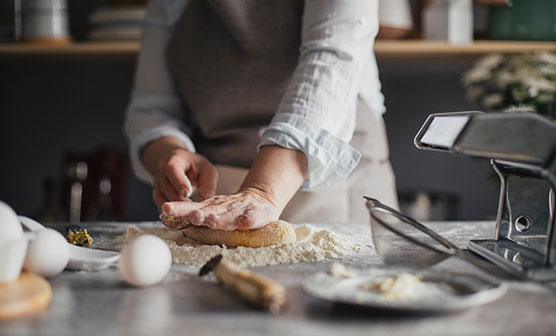 Hands of woman making dough